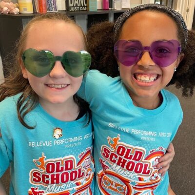 Girls in Old School performance t-shirts and sunglasses at bellePAC