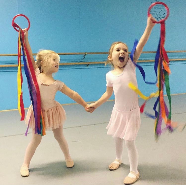 Kids dancing with rings and ribbon during class at BellePAC